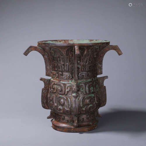 A taotie patterned bronze beaker vase