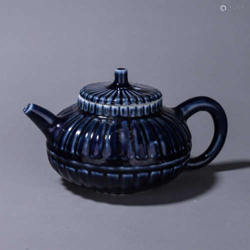 A blue glazed porcelain teapot