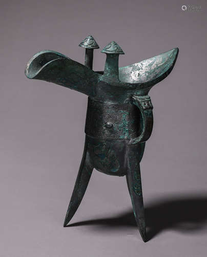 A taotie patterned three-legged bronze jue cup