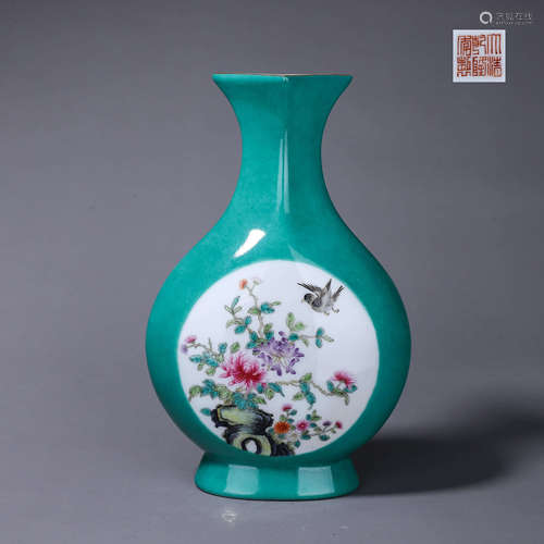 A green glazed famille rose bird and flower porcelain orname...