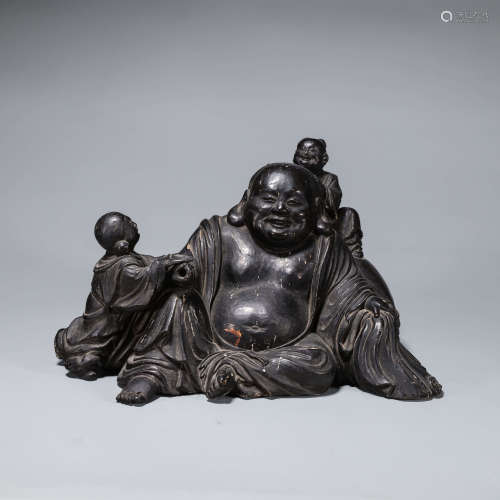 A wood Maitreya buddha statuette