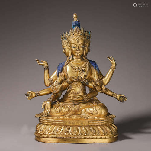 A gilding copper eight-armed Guanyin statue