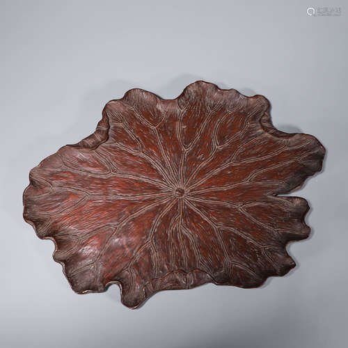 A lotus leaf shaped wood tray