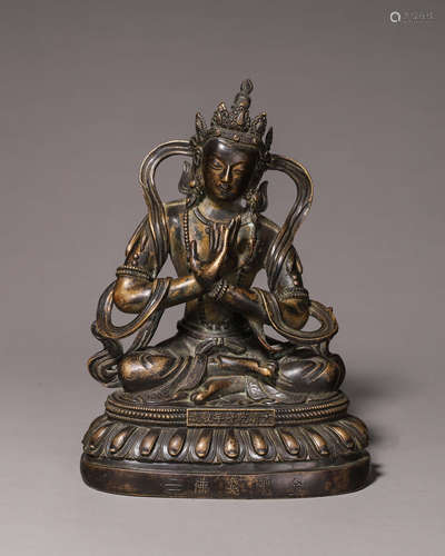 A copper buddha statue