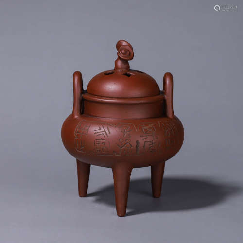 A three-legged hollowed out zisha ceramic incense burner