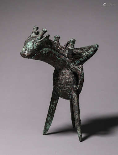 A taotie patterned bronze goat head pot
