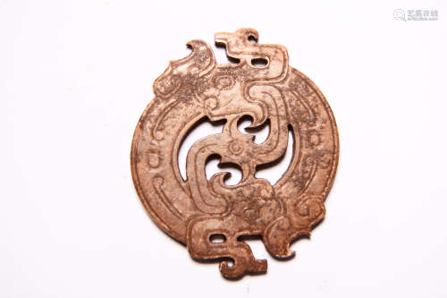 A Carved Brownish Jade Dragon Pendant