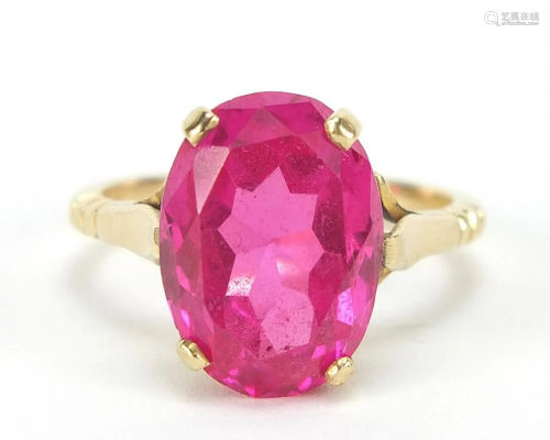 Unmarked gold ruby solitaire ring, the s...