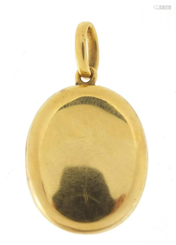 18ct gold oval locket, 3.5cm high, 8.2g