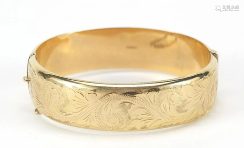 9ct gold hinged bangle with engraved dec...