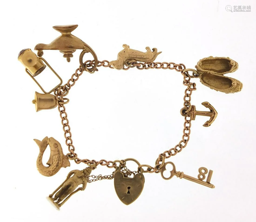 9ct gold charm bracelet with a selection...