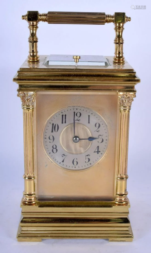 AN ANTIQUE BRASS REPEATING CARRIAGE CLOCK with …