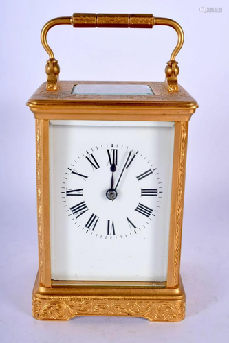 AN ANTIQUE BRASS ENGRAVED CARRIAGE CLOCK decor…