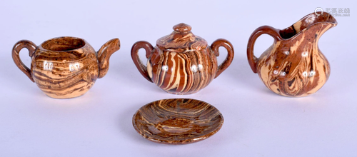 A RARE ANTIQUE MINIATURE SLIPWARE TEASET. Largest 4.5