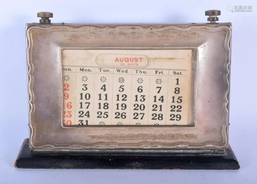 AN ANTIQUE SILVER DESK CALENDAR. 20 cm x 15 cm.