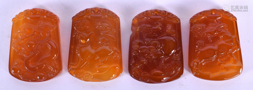 A RARE SET OF FOUR CHINESE CARVED AGATE ZODIAC PENDANTS