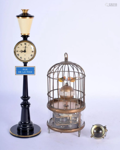 A CONTEMPORARY BIRD CAGE CLOCK together with a lamp