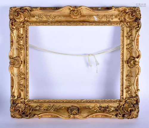 AN ANTIQUE CONTINENTAL GILTWOOD FRAME with shell and