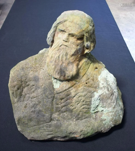 AN EARLY STONE CARVED FIGURE OF A BEARDED MALE modelled