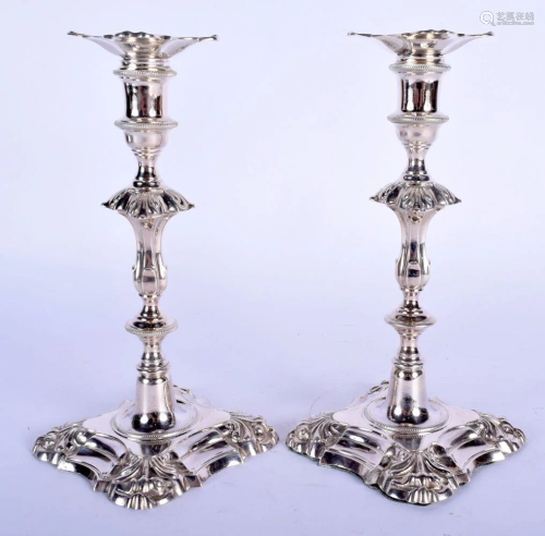 A PAIR OF GEORGE III STYLE SILVER CANDLESTICKS. London