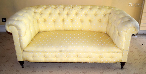 A GOOD QUALITY YELLOW GROUND UPHOLSTERED THEE SEATER