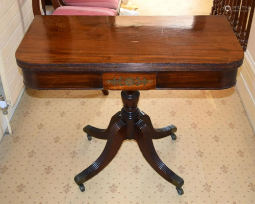 A REGENCY MAHOGANY FOLD OVER CARD TABLE with brass