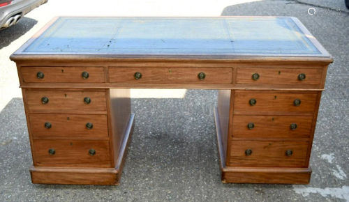 AN ANTIQUE LEATHER INSET PARTNERS DESK with drawers to