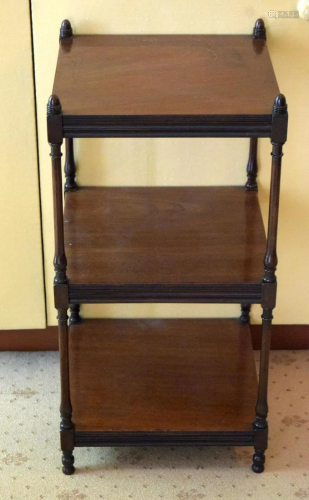 AN ANTIQUE MAHOGANY THREE TIER WHAT NOT of small