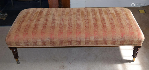 A LONG UPHOLSTERED RED AND GOLD GROUND OTTOMAN. 1…