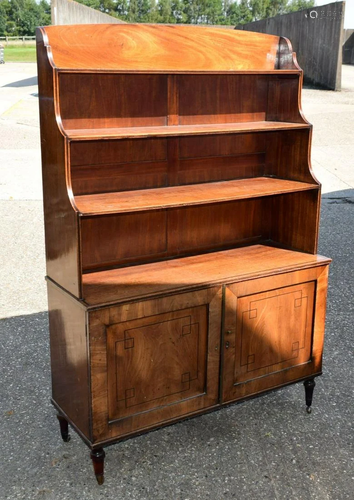 A REGENCY MAHOGANY WATERFALL BOOKCASE with geomet…