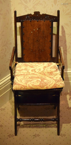 A GOTHIC REVIVAL TYPE METAMORPHIC CHAIR with hidden