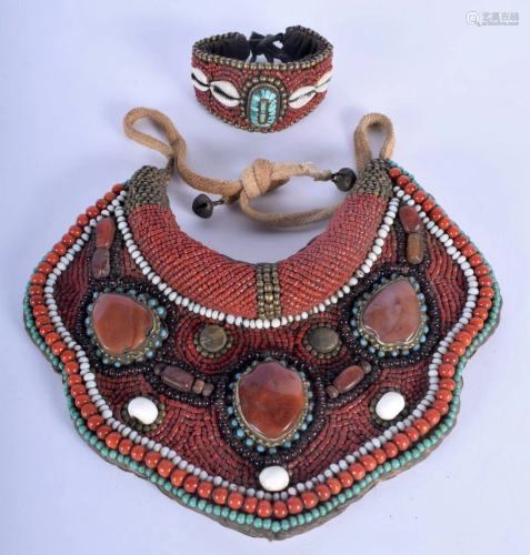 AN EARLY 20TH CENTURY TIBETAN CORAL TURQUOISE AND S…