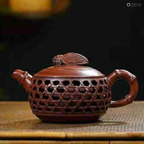 Chinese Yixing Teapot with skilled piercing techniques,