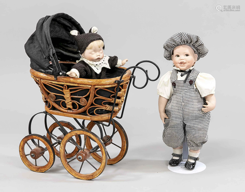 2 porcelain dolls in doll carr