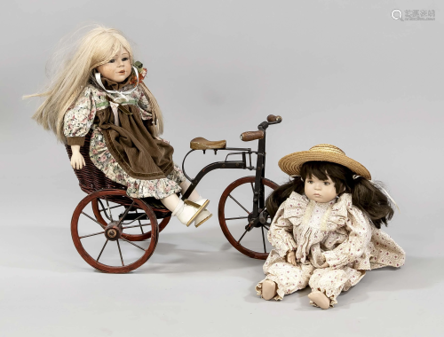 2 dolls on a tricycle, mid-20t