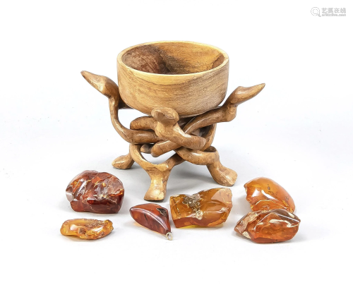 Wooden bowl on intertwined foo