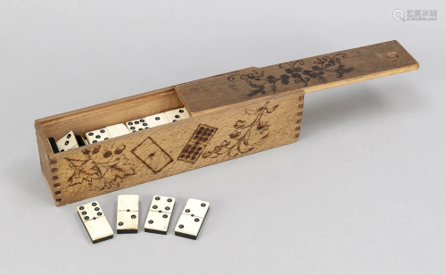 Game of dominoes in wooden box