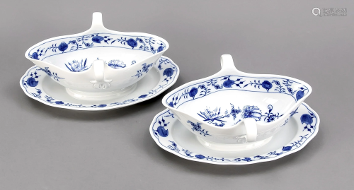 Two gravy boats with fixed saucers,