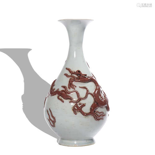 A white glazed 'dragon' pear-shaped vase