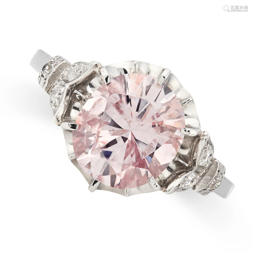 A NATURAL PINK DIAMOND AND WHITE DIAMOND RING set with