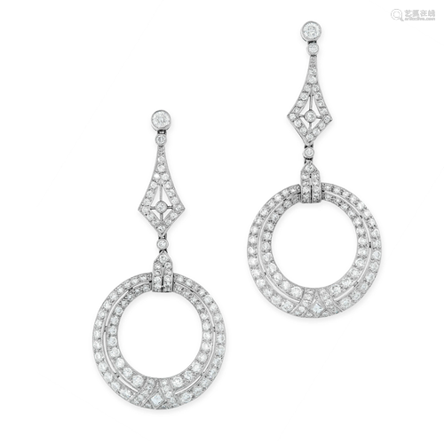 A PAIR OF DIAMOND EARRINGS each designed as a grad…