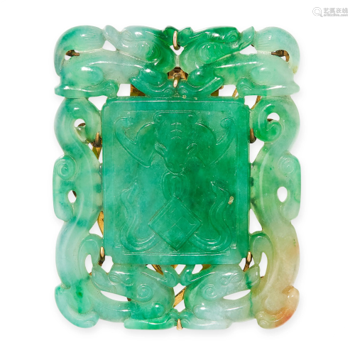 A NATURAL JADEITE JADE CLIP BROOCH in yellow gold,
