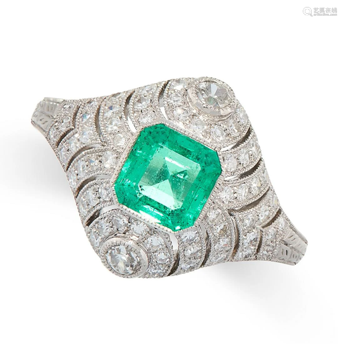 AN EMERALD AND DIAMOND RING in platinum, set with an