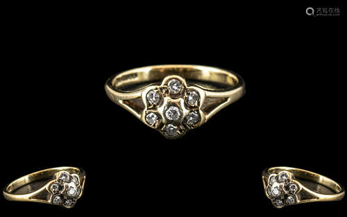 A 9ct Gold Diamond Chip Ring in a Flowerhead setting.