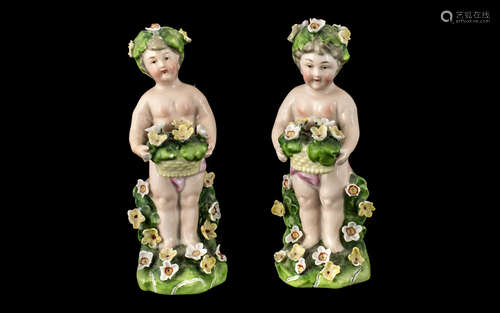 Pair of Antique Dresden Type Figures of Small Garlanded Cher...