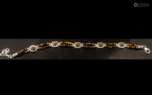 Tigers Eye Cabochon and Bead Bracelet, oval cabochons of tig...