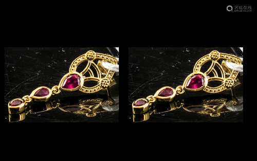 Ruby Triple Drop Earrings, each earring comprising three gra...