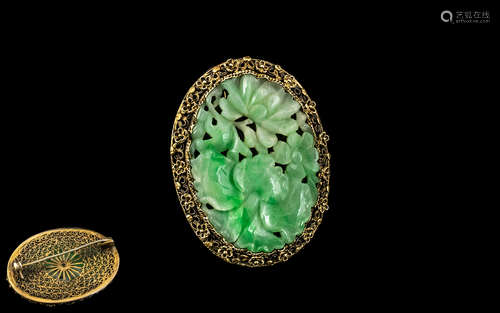 Antique Chinese Green Jade Brooch in a fancy yellow surround...