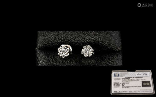 Platinum Diamond Stud Earrings set with a central round, mod...