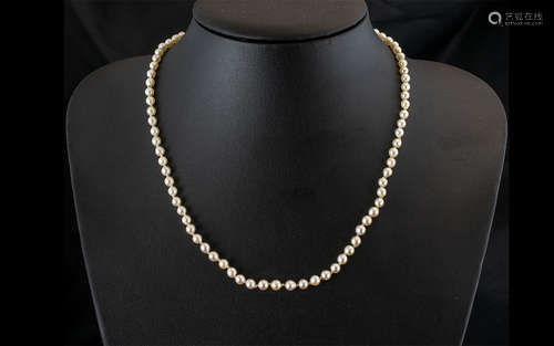 A Single Strand 16 inch Pearl Necklace with 9ct gold clasp.